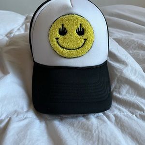 A smiley face trucker hat